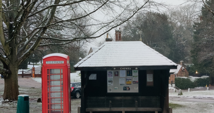 The bus shelter and phone box are feeling the cold